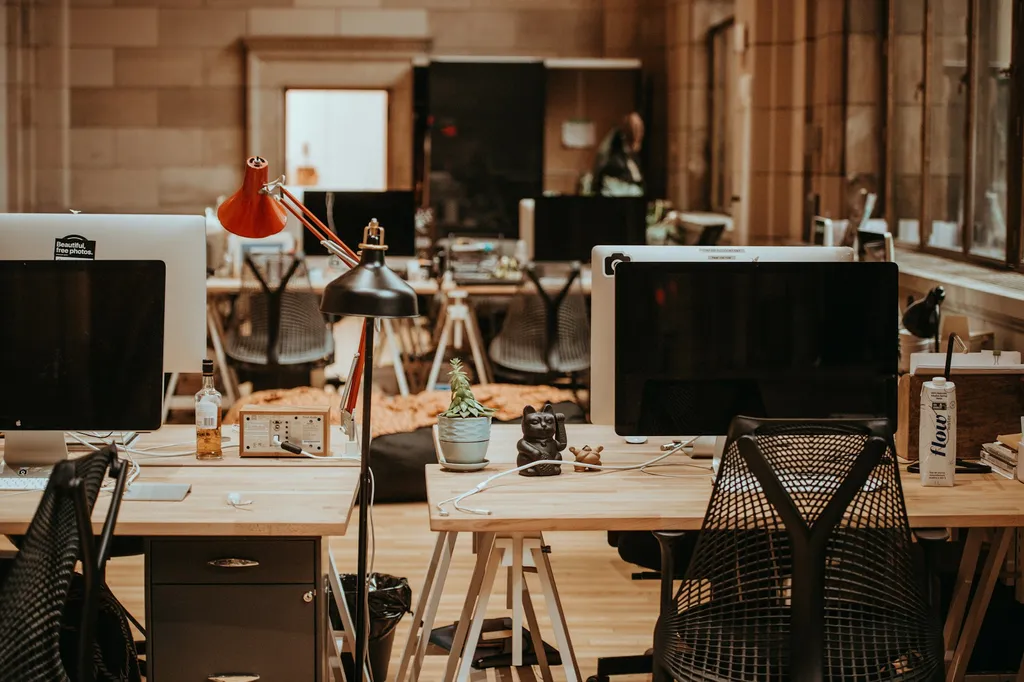 Clean tidy office workspace with neat desk surfaces and clear presentation